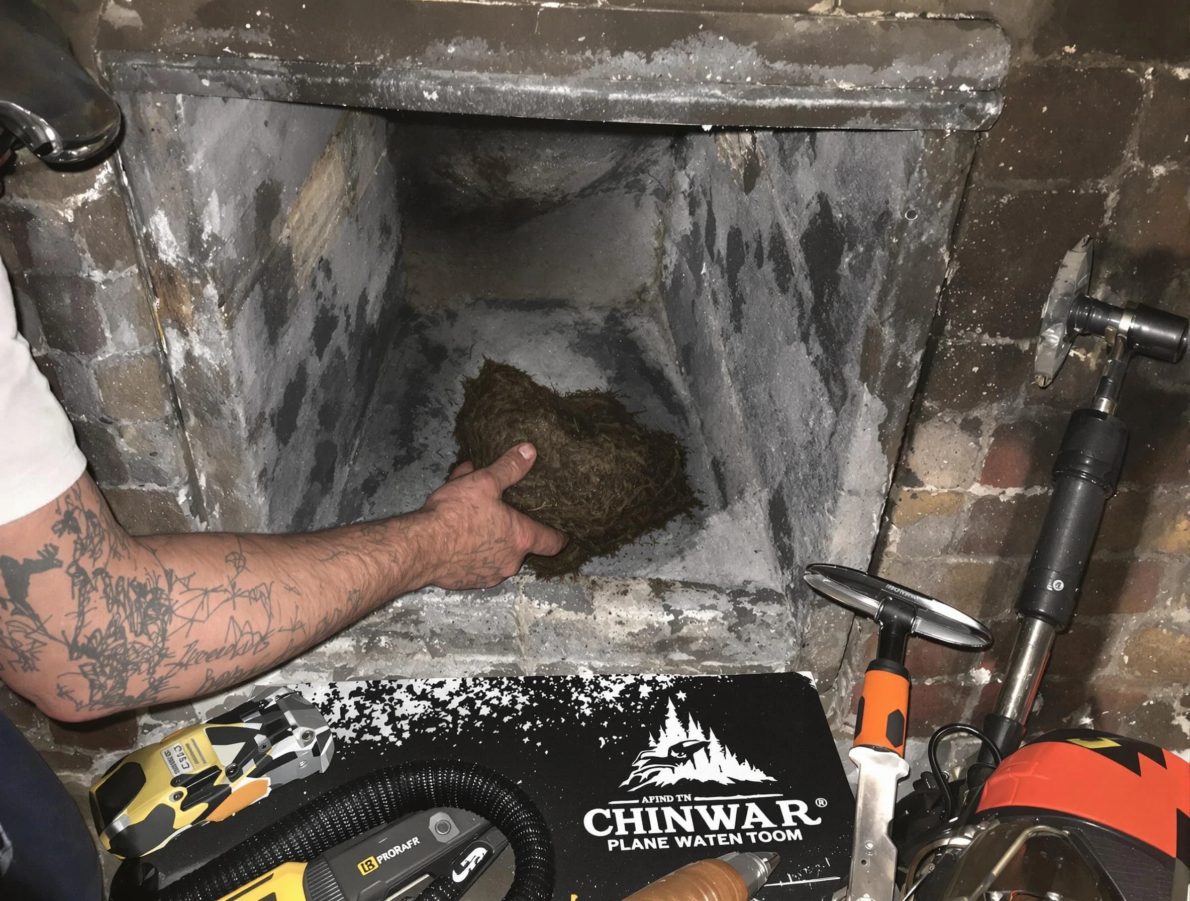 Falmouth Chimney Sweep safely removing debris and screening chimney in Falmouth, VA